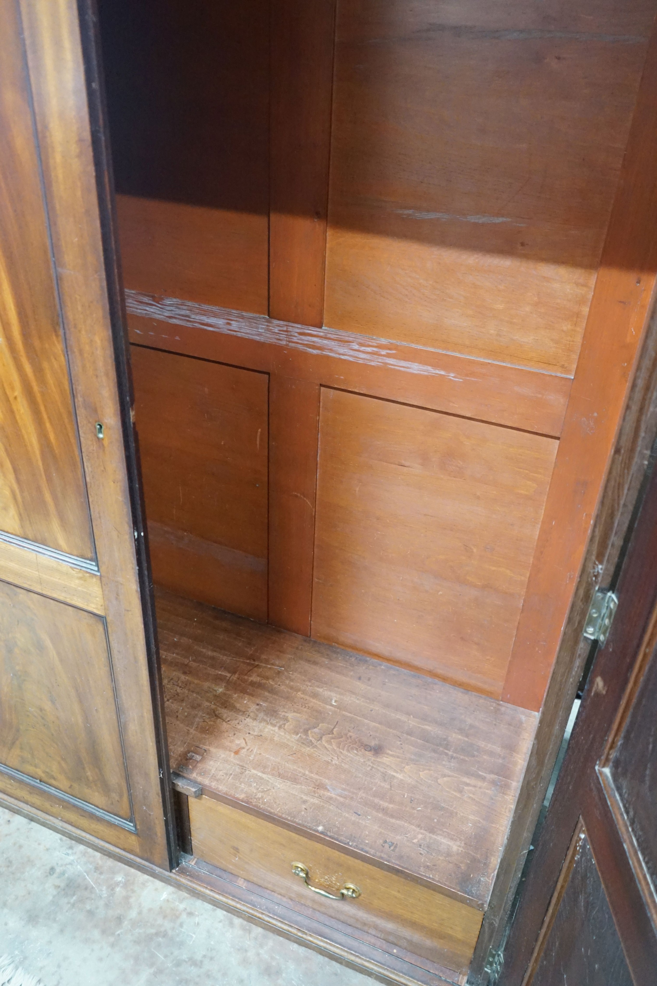 A 1920's mahogany wardrobe, width 126cm, depth 52cm, height 181cm